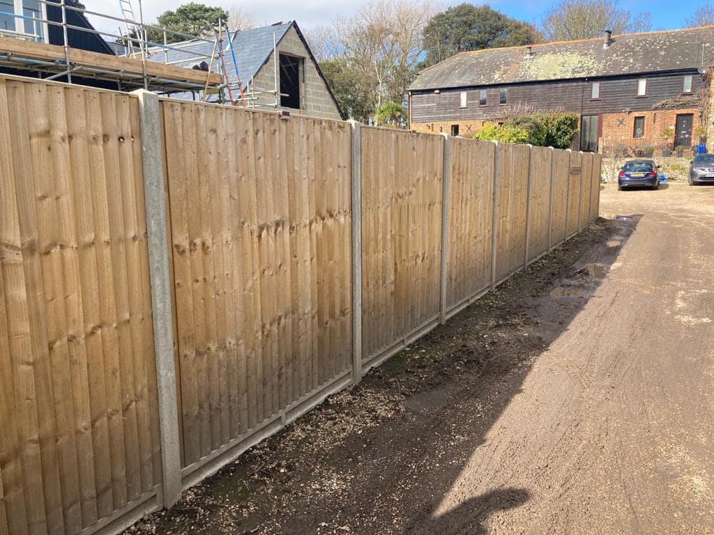Wooden fencing with six foot panels - Jackson Landscaping